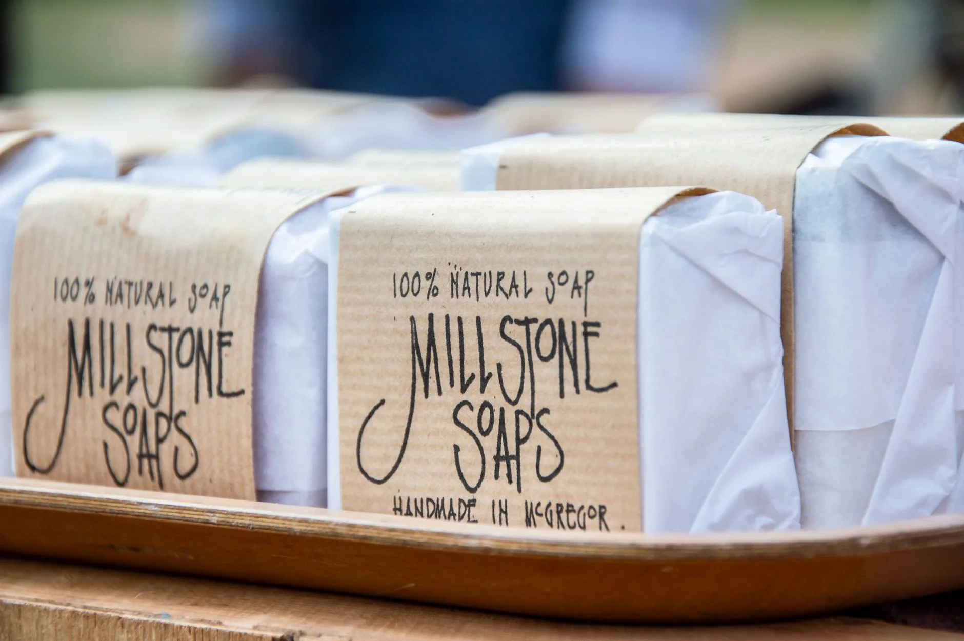 Close-up of handmade Millstone Soaps packaging showcasing natural and organic design.